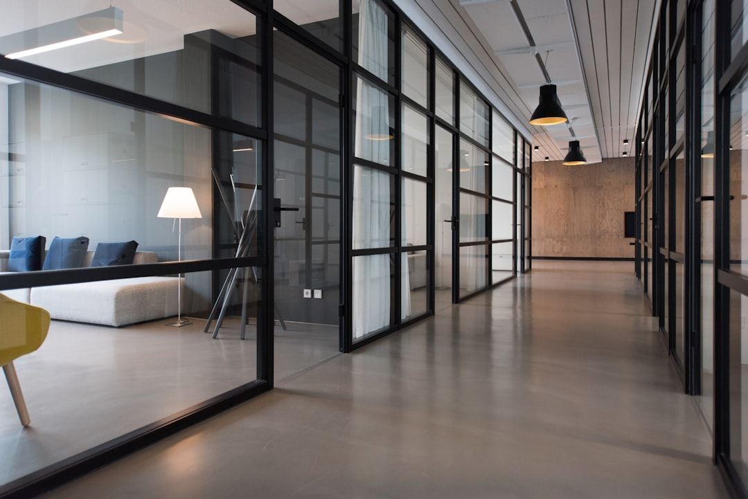 Clean modern glass-walled office corridor
